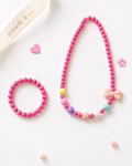 Colorful beaded necklace and bracelet with decorative elements on a white background