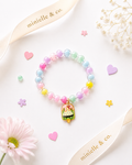 Pastel beaded bracelet with a popsicle charm on a white background with 'minielle & co.' branding.